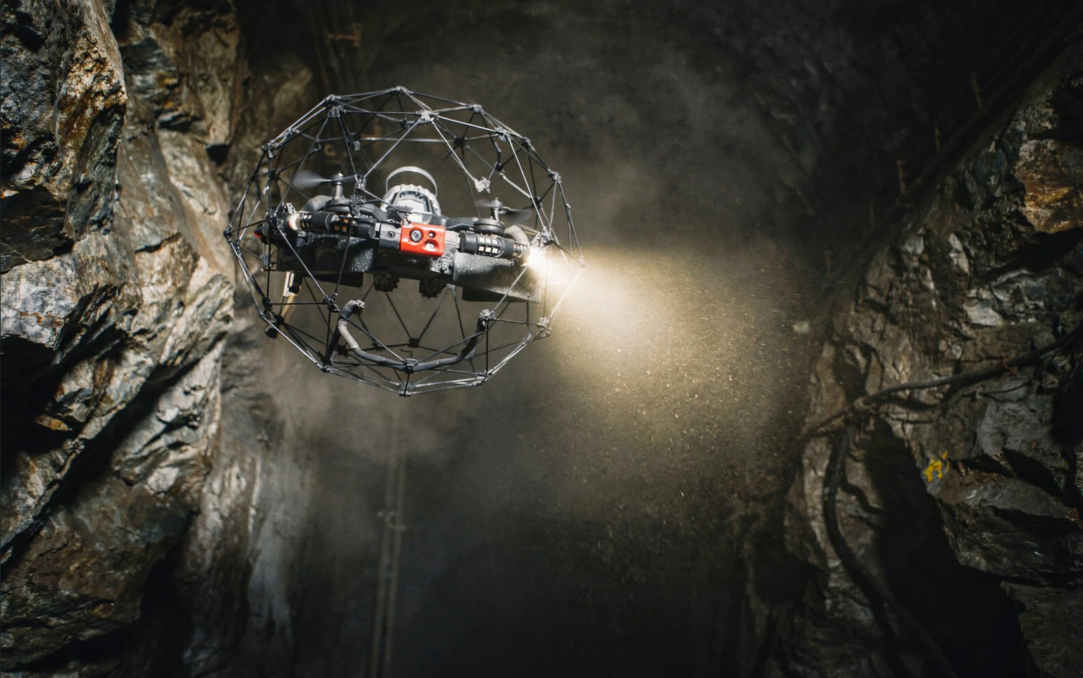 Caged, collision-tolerant inspection drone operating in a confined space.